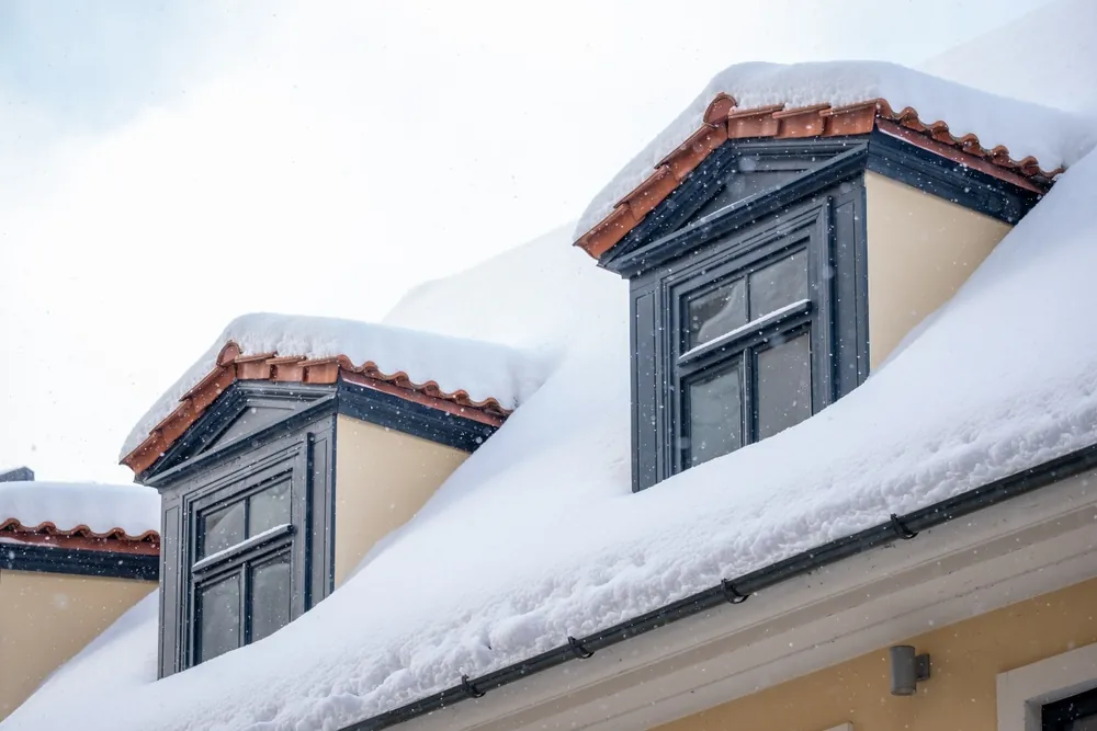 snow on the roof of a house