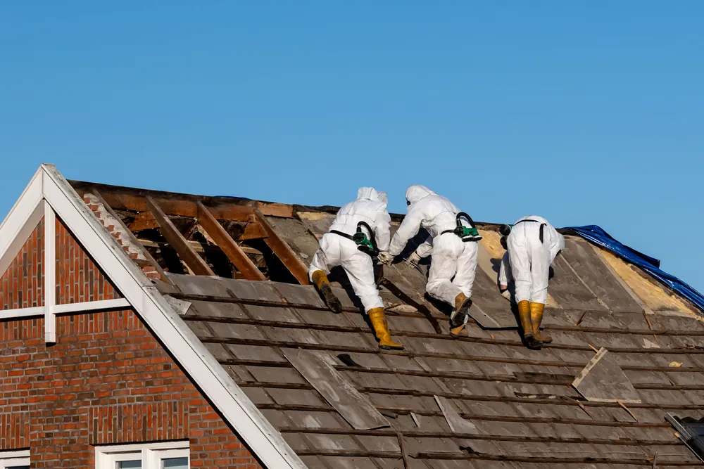 men restoring a roof house