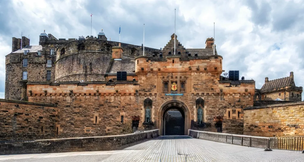 Edinburgh, Scotland - 16 July 2025: Edinburgh Castle under a vibrant cloudy sky, showcasing historic architecture in Scotland, UK