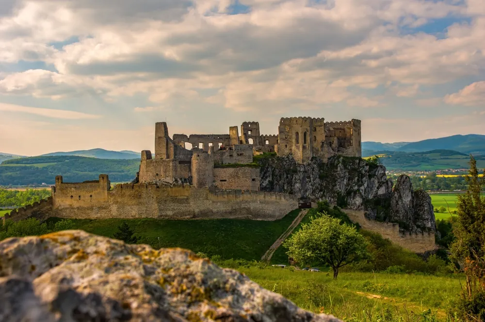 Medieval castle Beckov with the surrounding landscape on a spring day, Slovakia, Europe. Getting to know and discovering medieval architecture