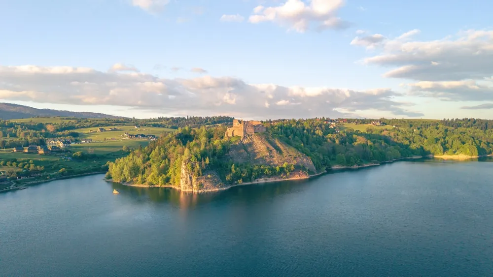 Ruins of Czorsztyn castle over Czorsztyn lake in Pieniny, Poland during sunset.