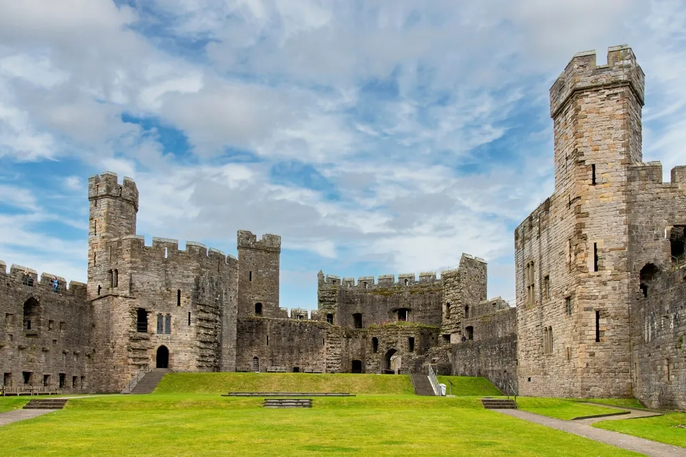 Courtyard of medieval fortress Caernarfon Castle, Caernarfon, UK a motte-and-bailey castle from 11th century which King Edward I of England began to replace with the current stone structure in 1283