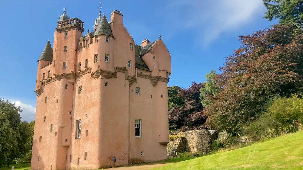 Alford, Aberdeenshire, Scotland - 09.10.2022: View of Craigievar, the famous pink Scottish castle tower in Aberdeenshire which looks like it should be in a fairytale or Disney movie.