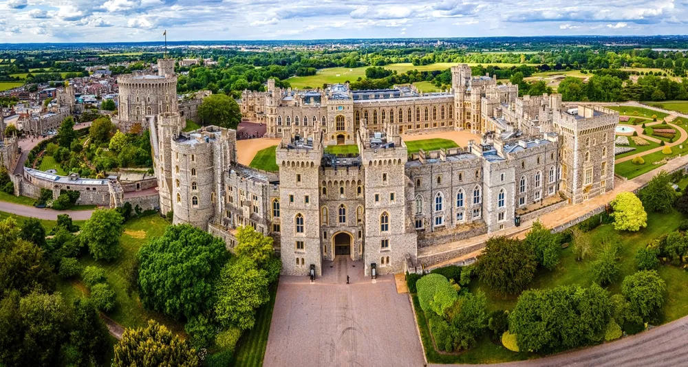 Aerial image of Windsor Castle in England, ideal for promoting British heritage, travel, real estate, luxury, monarchy, architecture, history, and tourism industries