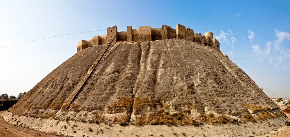 Famous fortress and citadel in Aleppo, Syria. One of the oldest inhabited cities in the world. View to the East side wall.
