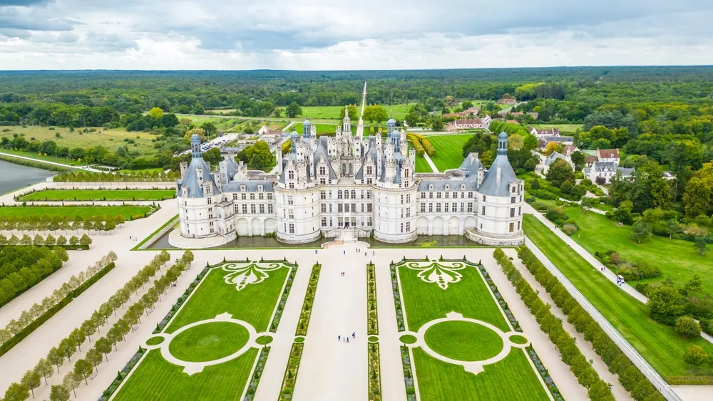 Aerial view of Château de Chambord, the largest and most majestic castle of the Loire Valley in France. Renaissance masterpiece with distinctive towers and intricate roofline, surrounded by vast park