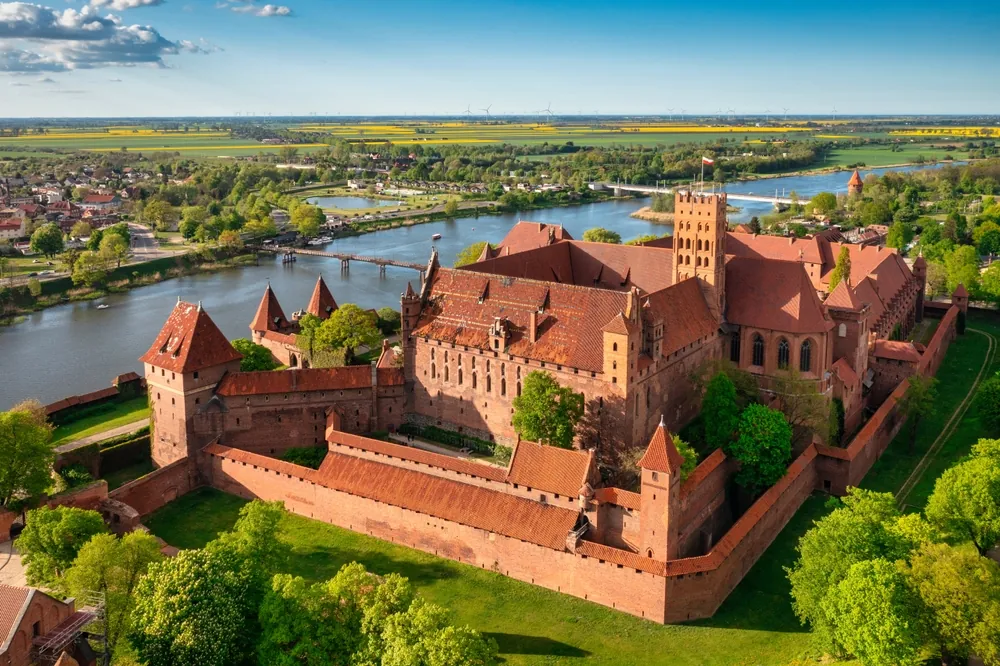 The Castle of the Teutonic Order in Malbork by the Nogat river. Poland