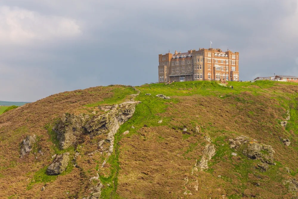 Tintagel, United Kingdom - May 02, 2014: View of Tintagel Island and legendary Tintagel castle ruins on a spring day.