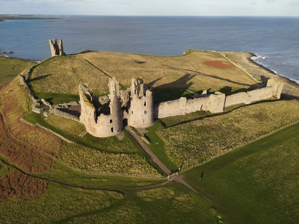 Dunstanburgh Castle, Northumberland coast Aerial view. 