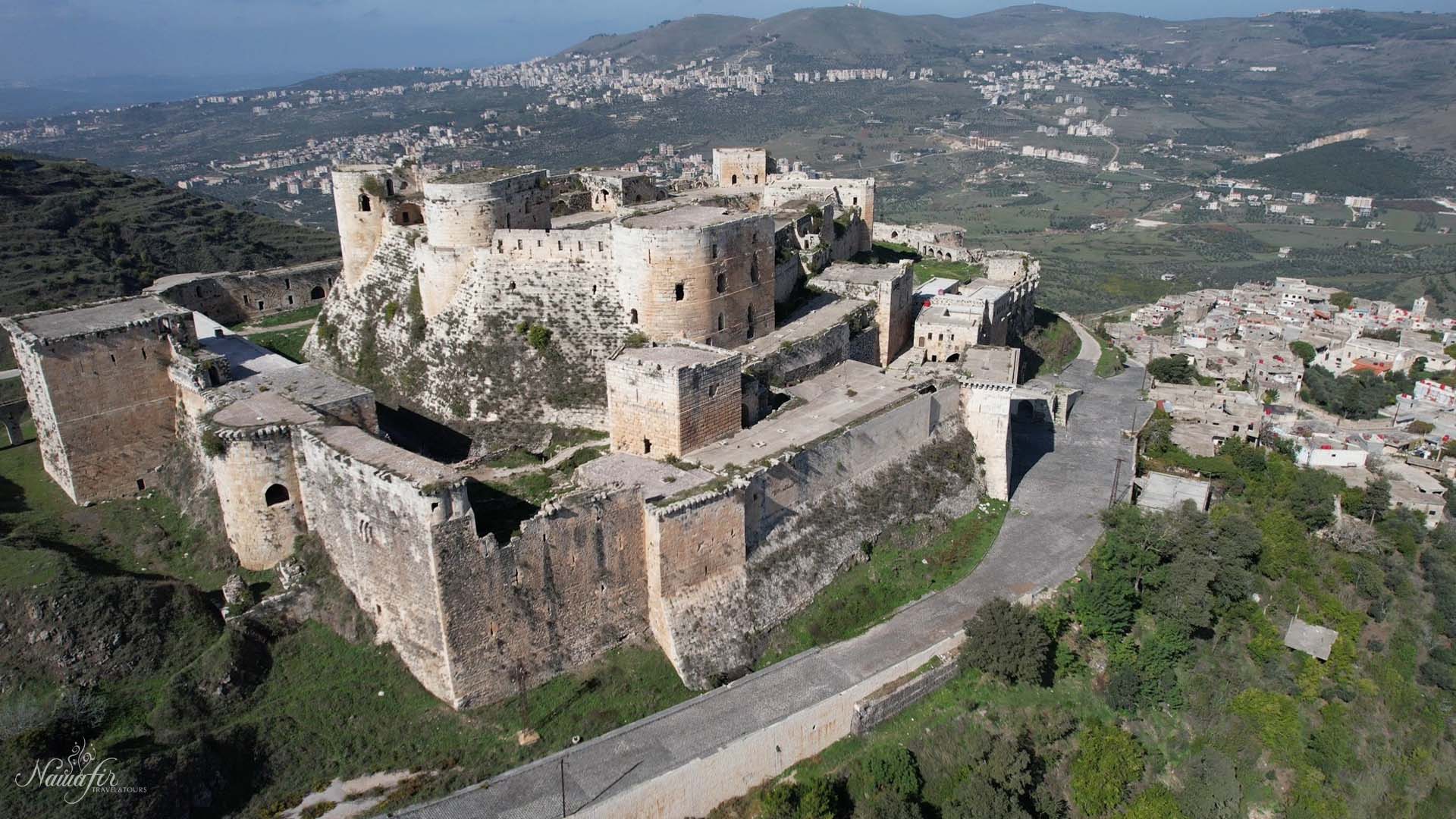 Krak des Chevaliers as example of crusader concentric — types of castles, castle architecture