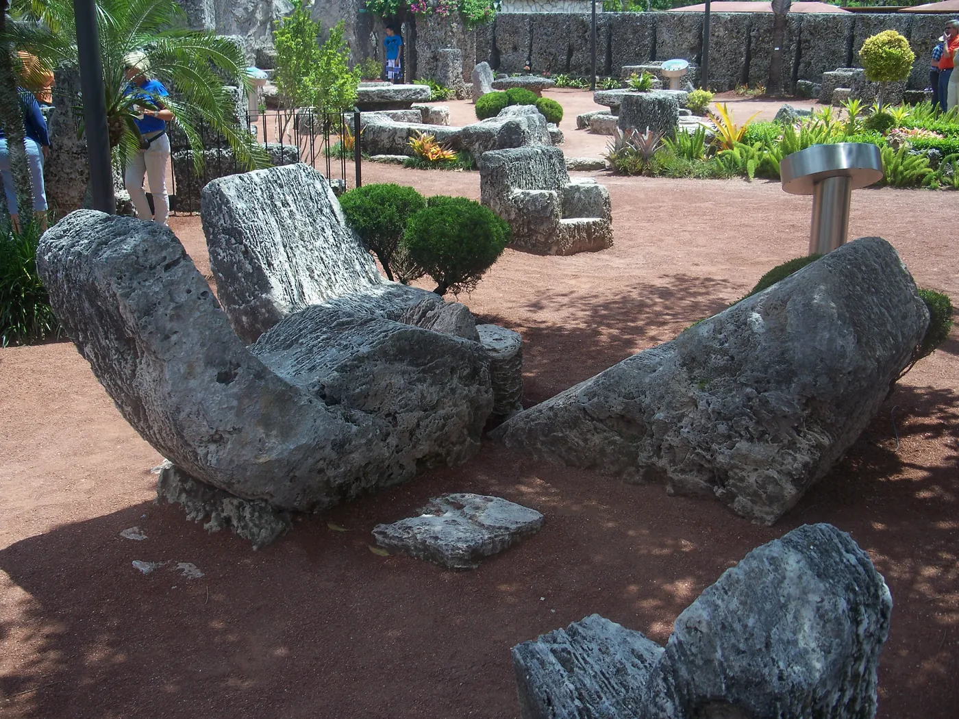 Solid-stone rocking chairs carved from oolite limestone at Coral Castle
