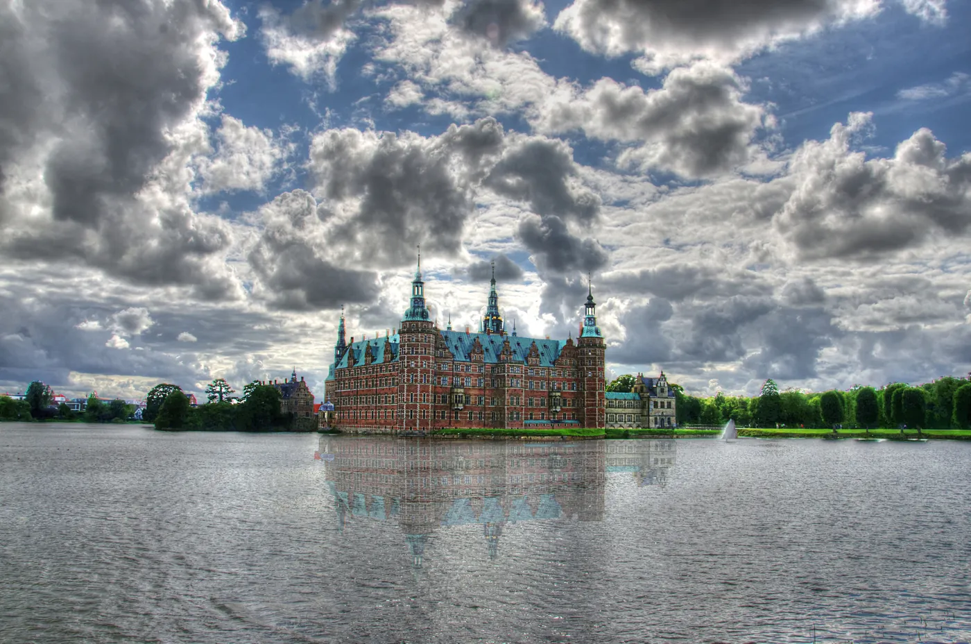 Frederiksborg Castle reflected in its lake, a fairytale castle in Denmark